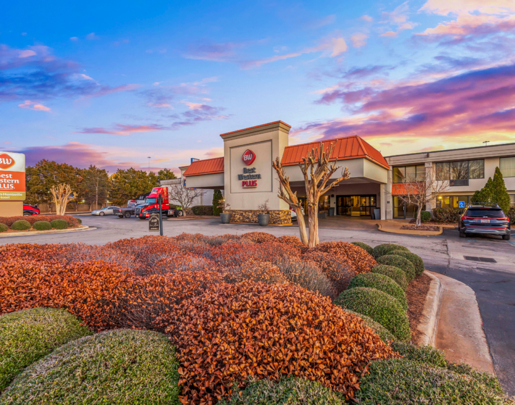 Commercial property exterior with landscaping and parking
