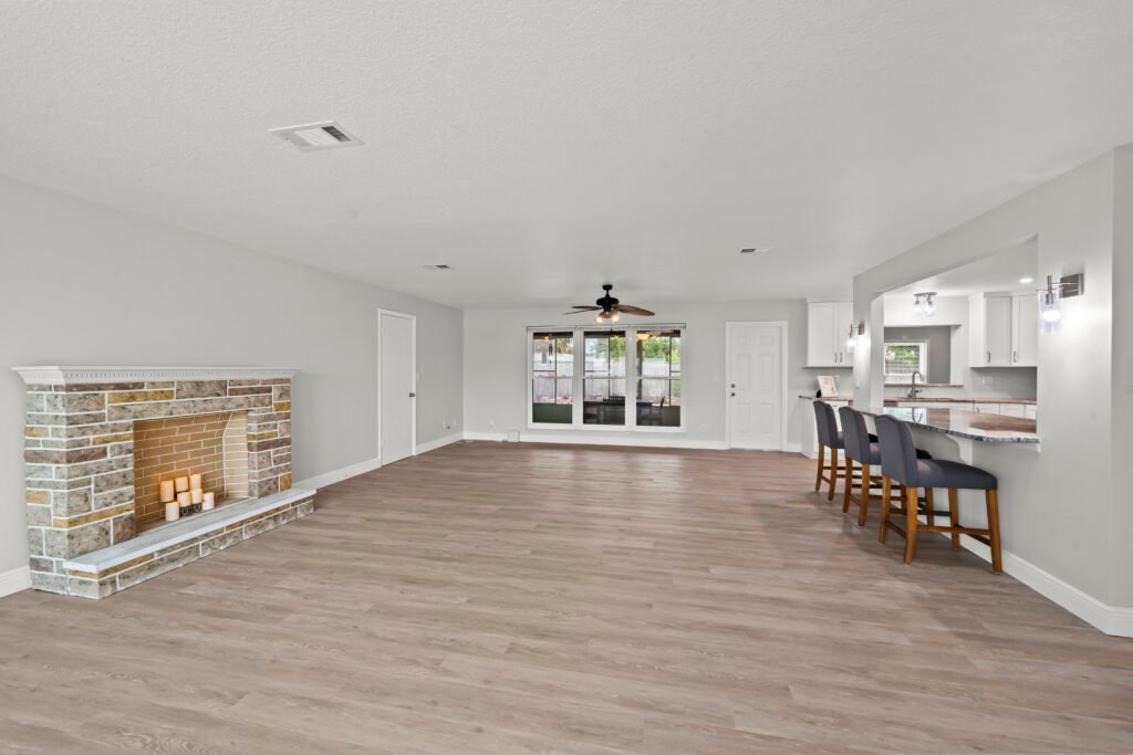 Open living and dining area with hardwood flooring