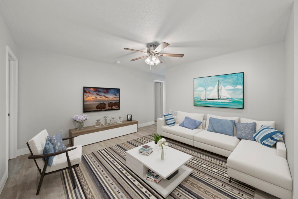 Bedroom with television, bed, and ceiling fan